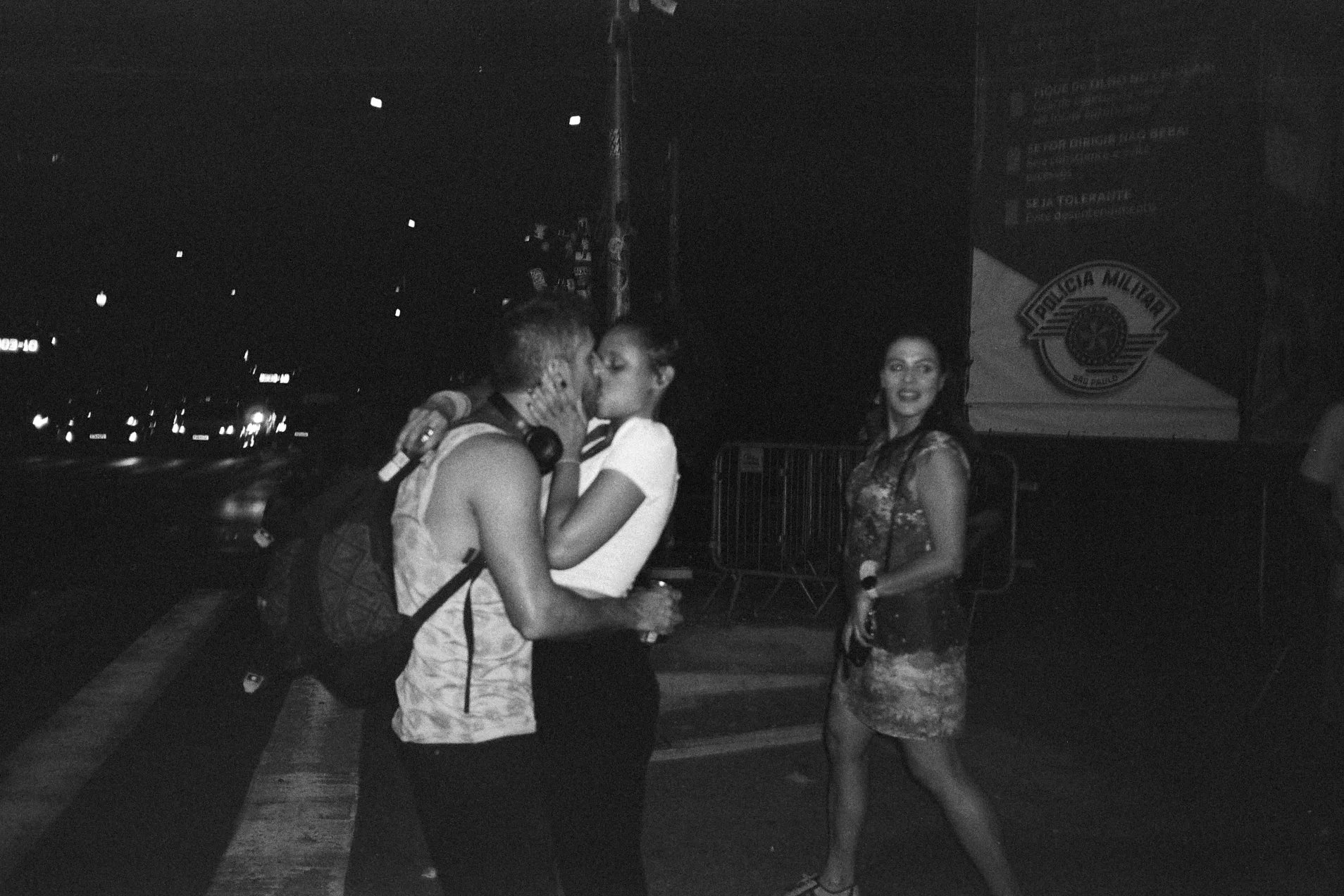 Black-and-white photograph of people dancing at night